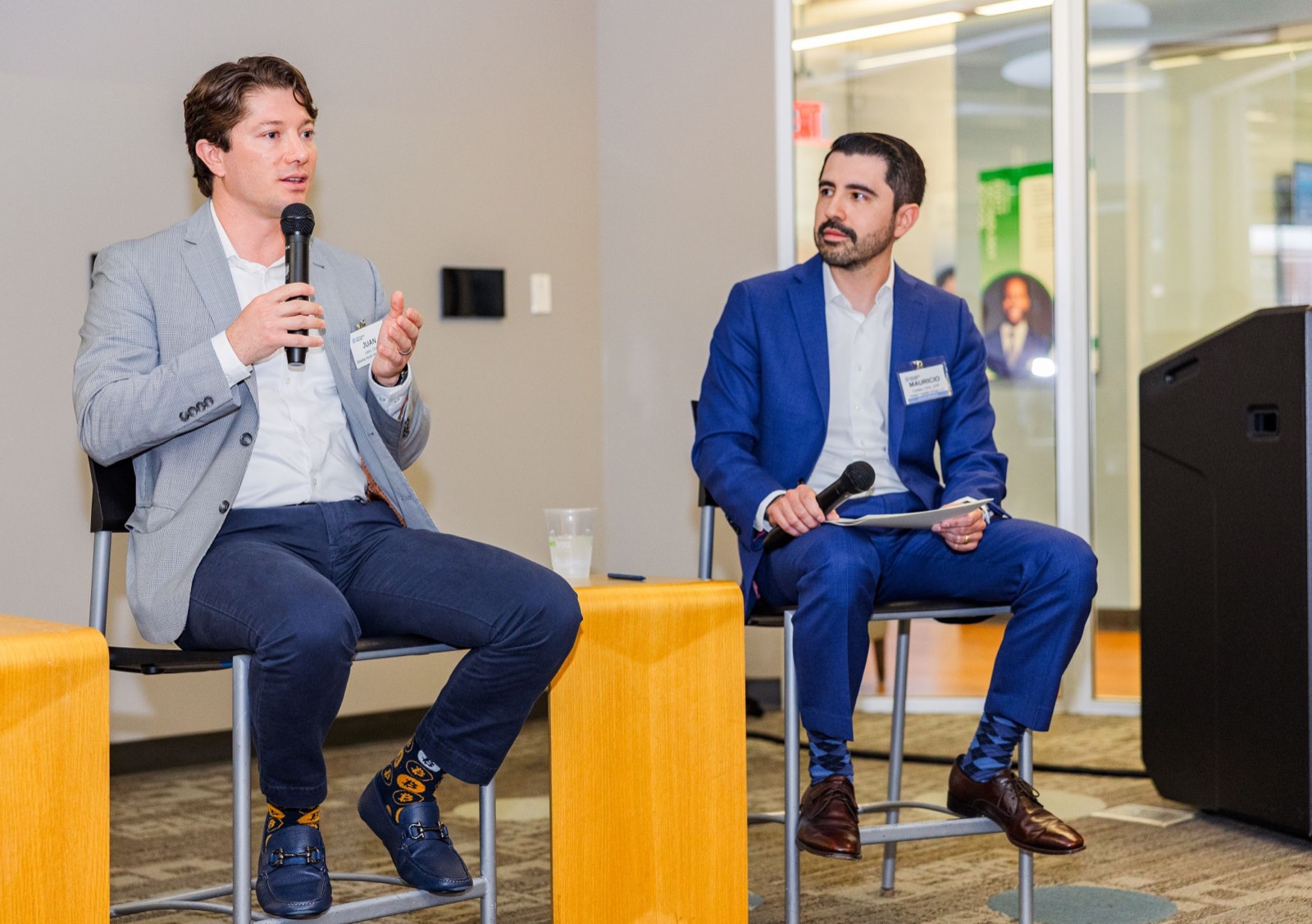 Two panelists, one speaking