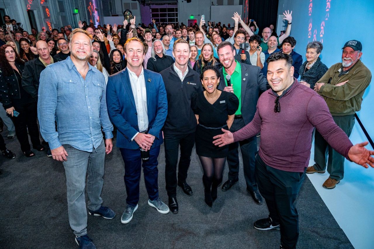 A group photo in front of the crowd at the Mangrove Nashville meetup